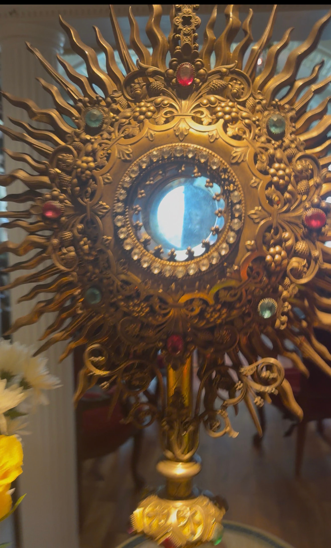 Close-up of an ornate golden monstrance with jeweled details at Universal Sanctuary Church