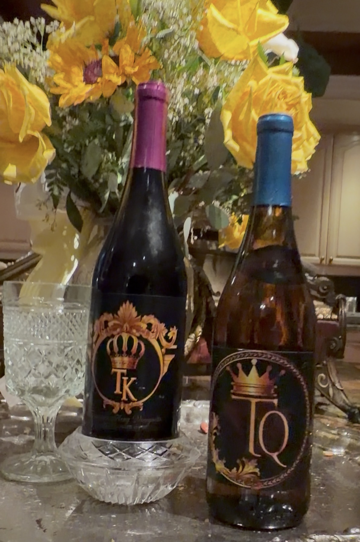 Crowns-adorned wine bottles and crystal glasses set for a celebration at Universal Sanctuary Church