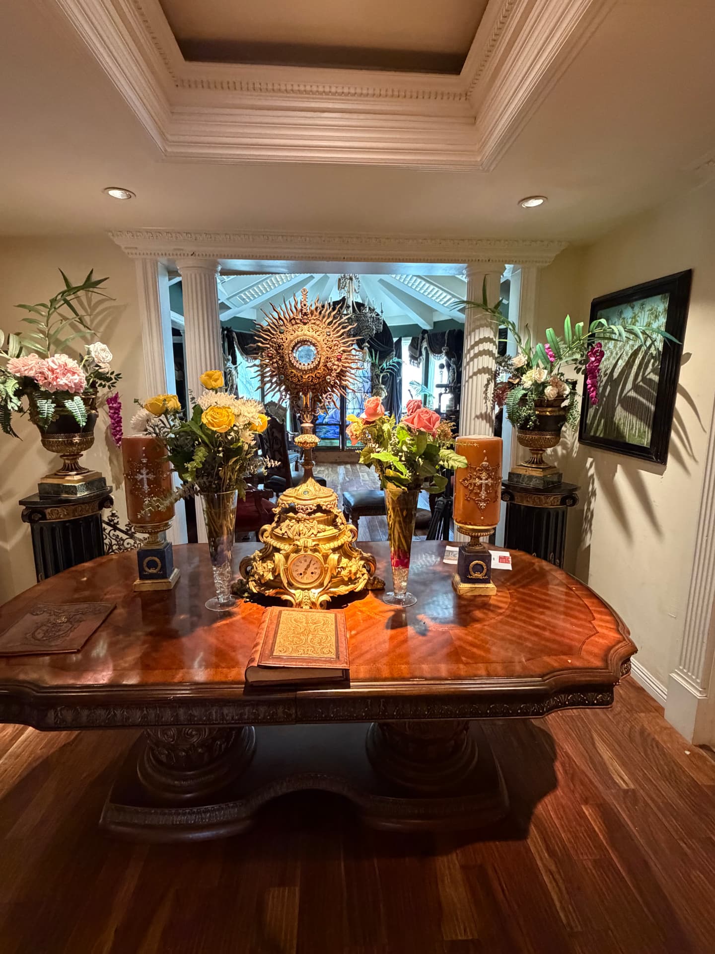 Sacred art display, flowers and carved wood table inside Universal Sanctuary Church