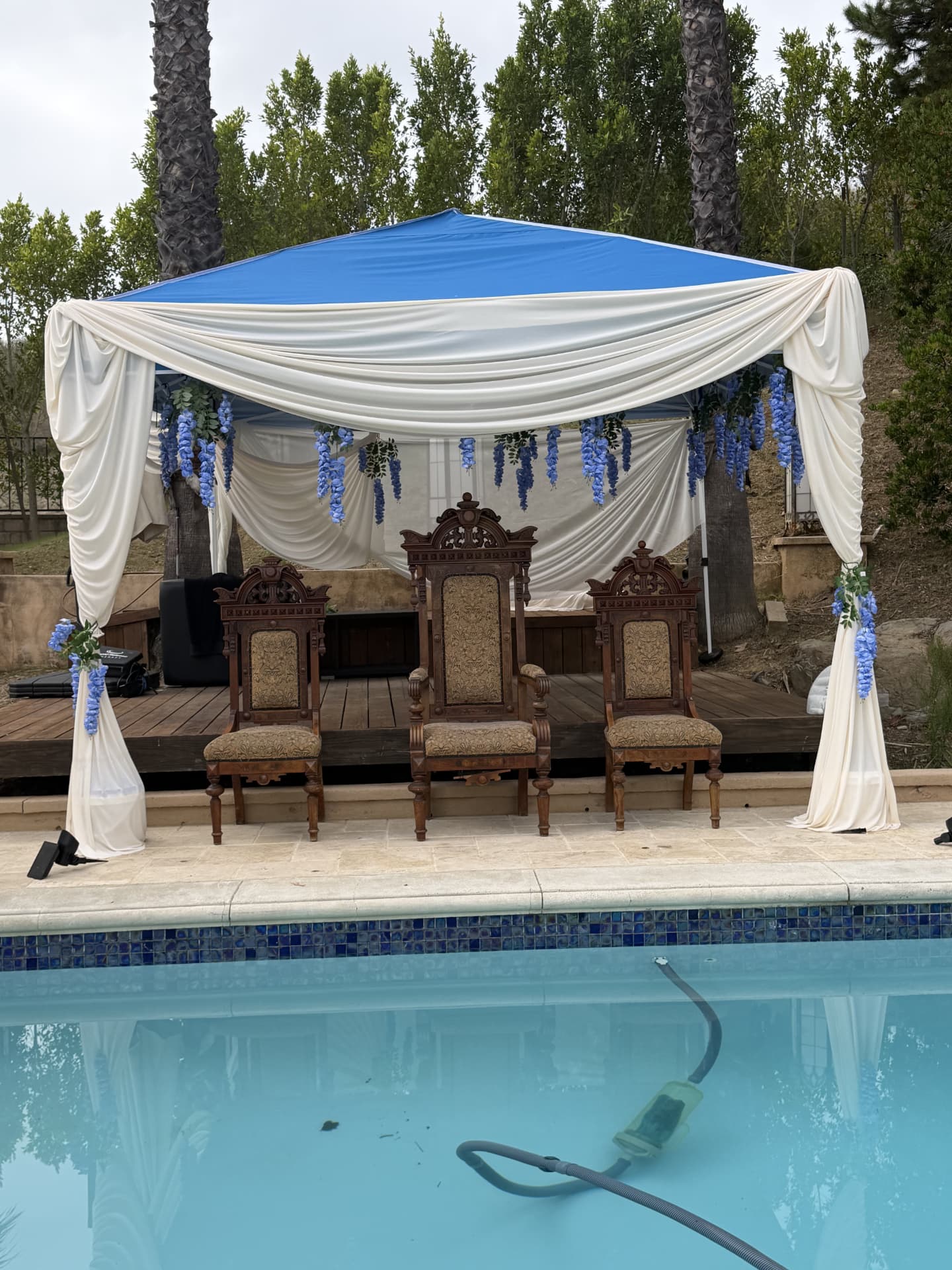 Poolside ceremony stage set for a celebration at Universal Sanctuary Church