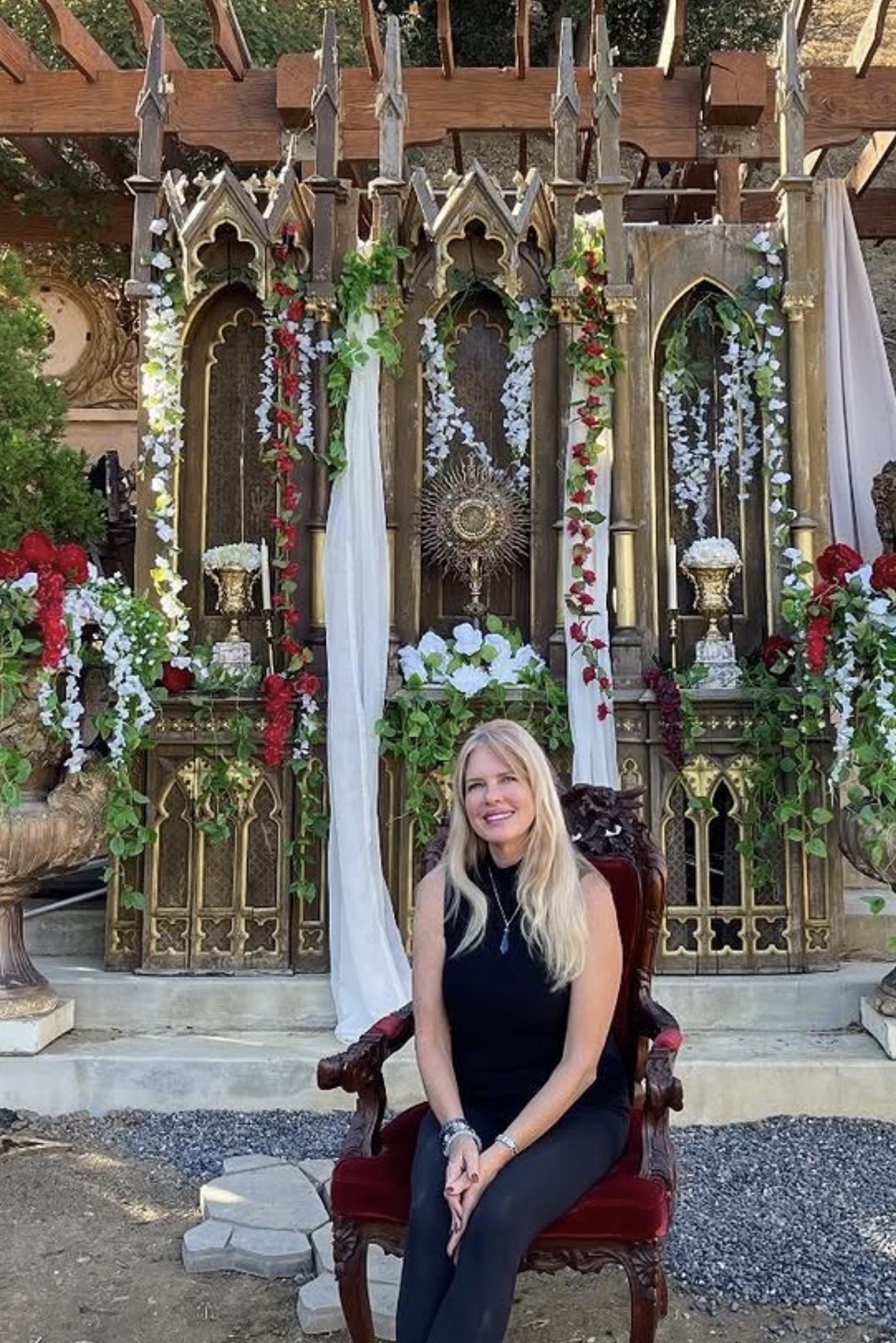 Ornate gothic altar dressed with flowers and candles at Universal Sanctuary Church