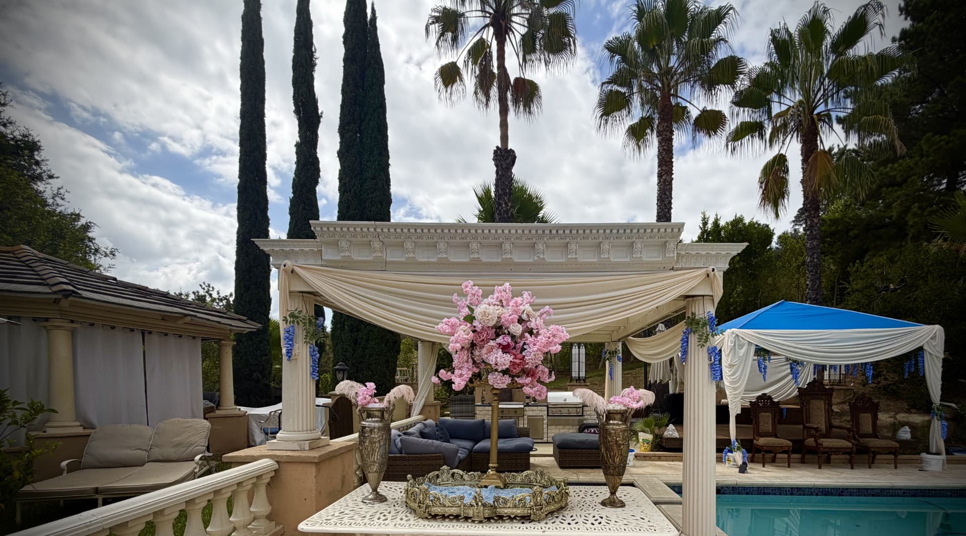 Wide view of the poolside pavilion and event grounds at Universal Sanctuary Church